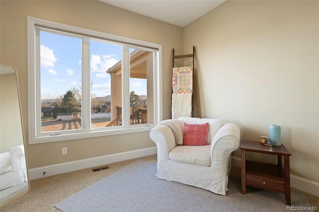 living area featuring carpet floors