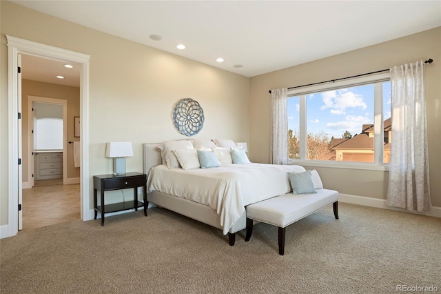 bedroom featuring carpet and ensuite bath