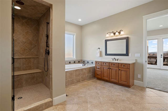 bathroom featuring tile patterned floors, vanity, and independent shower and bath