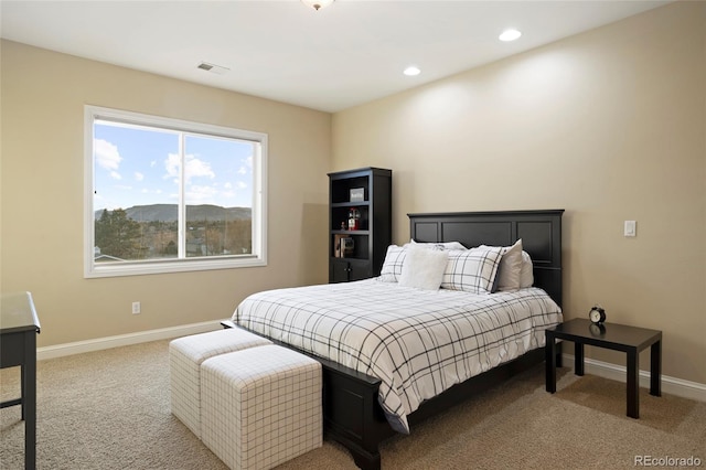 carpeted bedroom with a mountain view