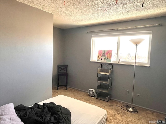 carpeted bedroom with a textured ceiling