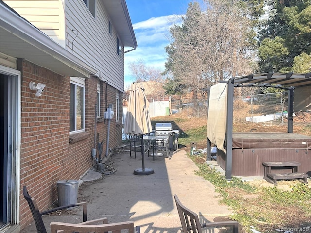 view of patio featuring a pergola and a hot tub