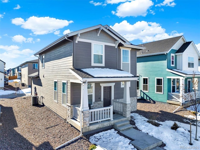 view of front of home with cooling unit and covered porch