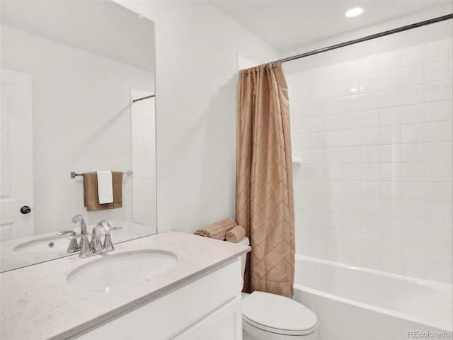 full bathroom featuring vanity, shower / bath combination with curtain, and toilet