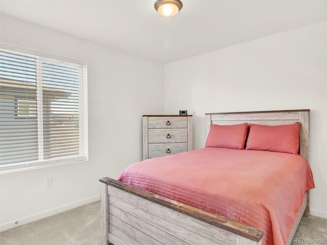 bedroom featuring light carpet