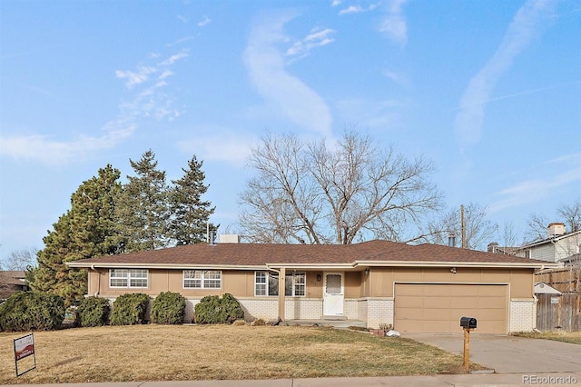 ranch-style home with driveway, a front lawn, fence, an attached garage, and brick siding