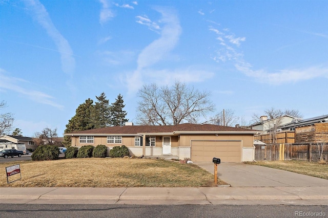 single story home with a garage, concrete driveway, a front lawn, and fence