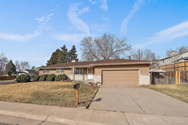 ranch-style house with brick siding, a front lawn, and fence