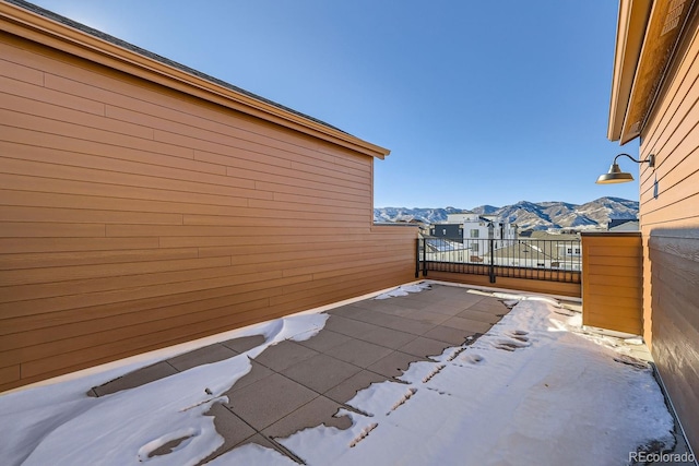 snow covered property featuring a mountain view