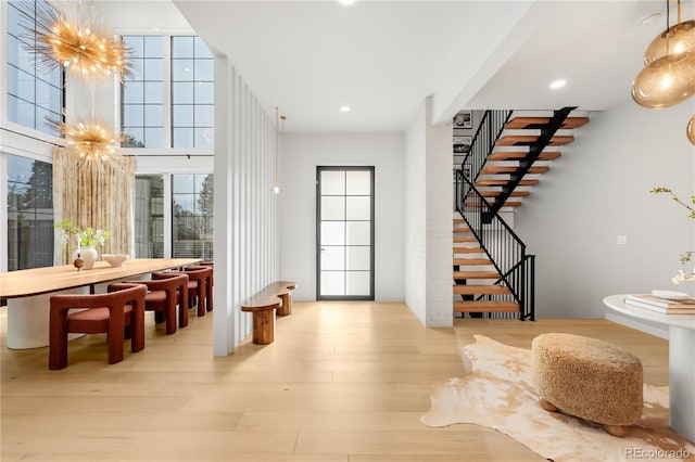 1001 S Adams St, Denver, CO 80209 - foyer featuring stairway, wood finished floors, healthy amount of natural light, and recessed lighting
