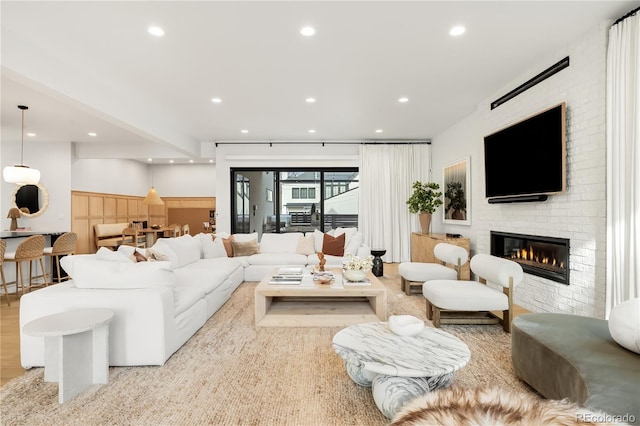 1001 S Adams St, Denver, CO 80209 - living room featuring recessed lighting and a brick fireplace