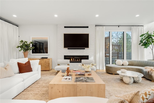 1001 S Adams St, Denver, CO 80209 - living room featuring recessed lighting and a brick fireplace