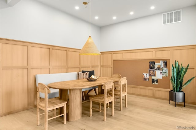 1001 S Adams St, Denver, CO 80209 - dining room with a decorative wall, light wood-type flooring, a wainscoted wall, and recessed lighting