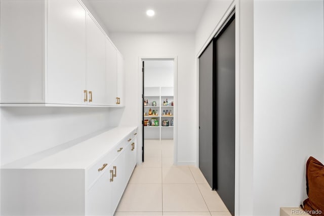 1001 S Adams St, Denver, CO 80209 - hallway featuring light tile patterned floors and recessed lighting
