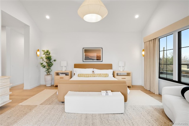 1001 S Adams St, Denver, CO 80209 - bedroom featuring wood finished floors, vaulted ceiling, baseboards, and recessed lighting