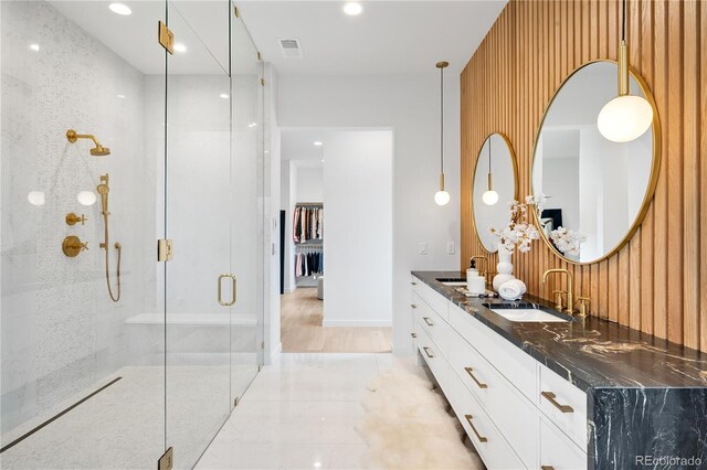 1001 S Adams St, Denver, CO 80209 - full bathroom featuring a shower stall, double vanity, and recessed lighting