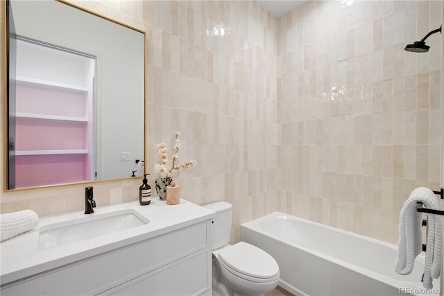 1001 S Adams St, Denver, CO 80209 - full bathroom with tile walls, toilet, vanity, and shower / washtub combination