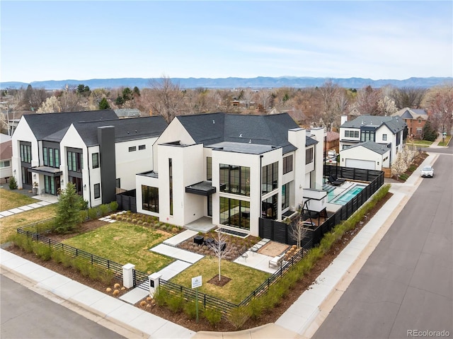 1001 S Adams St, Denver, CO 80209 - view of front of house with a residential view, stucco siding, and a mountain view