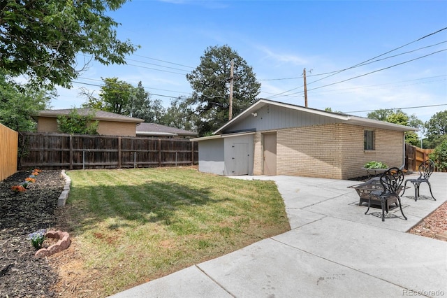 995 Ironton St, Aurora, CO 80010 - fenced backyard featuring an outdoor fire pit and a patio