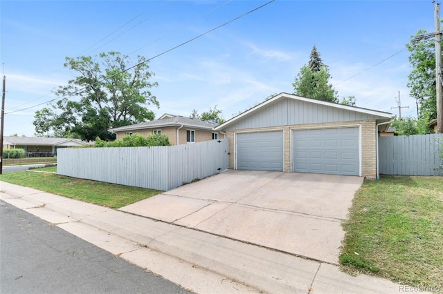995 Ironton St, Aurora, CO 80010 - view of front facade featuring brick siding and a garage