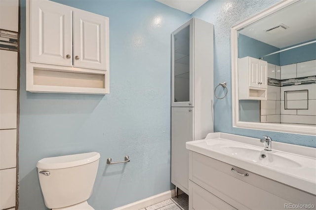 full bathroom with visible vents, baseboards, toilet, and vanity