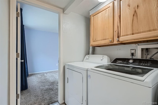 laundry room featuring cabinet space, baseboards, carpet, and separate washer and dryer