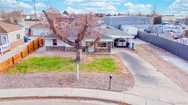 view of front of property featuring a carport