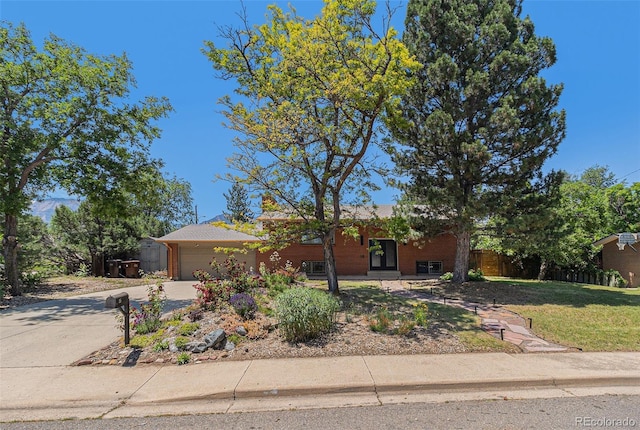 15 Pawnee Dr, Boulder, CO 80303 - view of front of house with an attached garage and concrete driveway