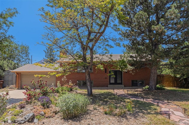 15 Pawnee Dr, Boulder, CO 80303 - view of front of home with an attached garage, driveway, and brick siding