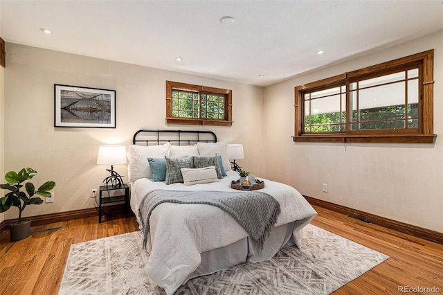 15 Pawnee Dr, Boulder, CO 80303 - bedroom featuring multiple windows, wood finished floors, and recessed lighting