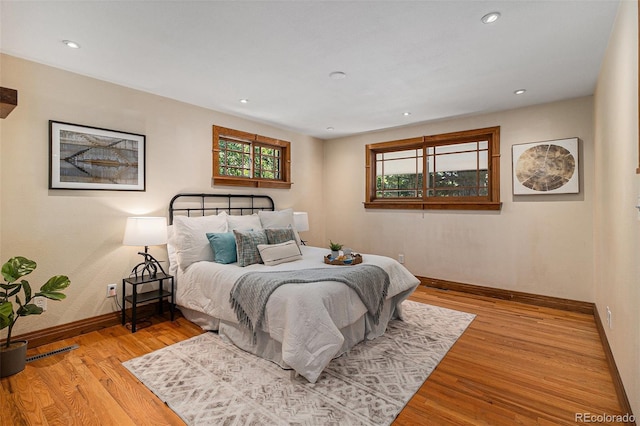 15 Pawnee Dr, Boulder, CO 80303 - bedroom featuring multiple windows, wood finished floors, and recessed lighting