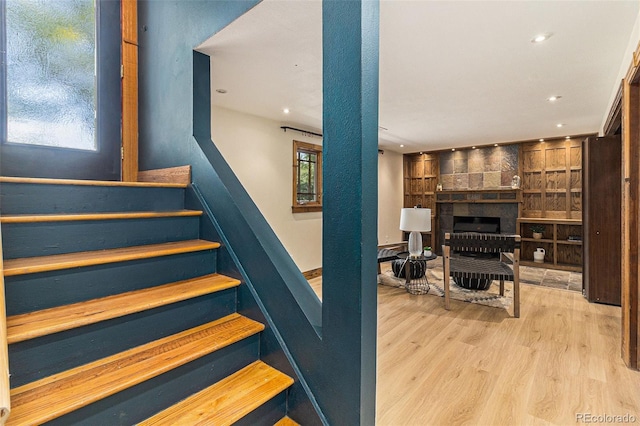 15 Pawnee Dr, Boulder, CO 80303 - stairway with wood finished floors, recessed lighting, and a brick fireplace