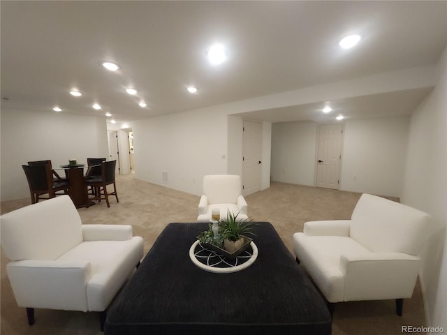 living room with recessed lighting and light colored carpet