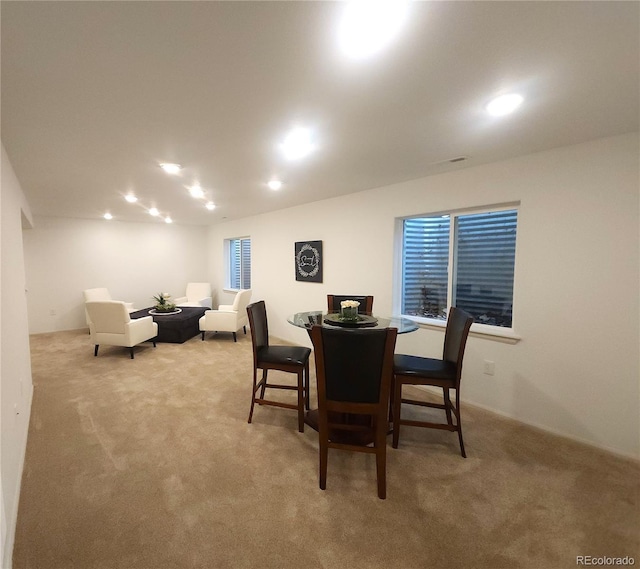 dining area with carpet flooring and recessed lighting