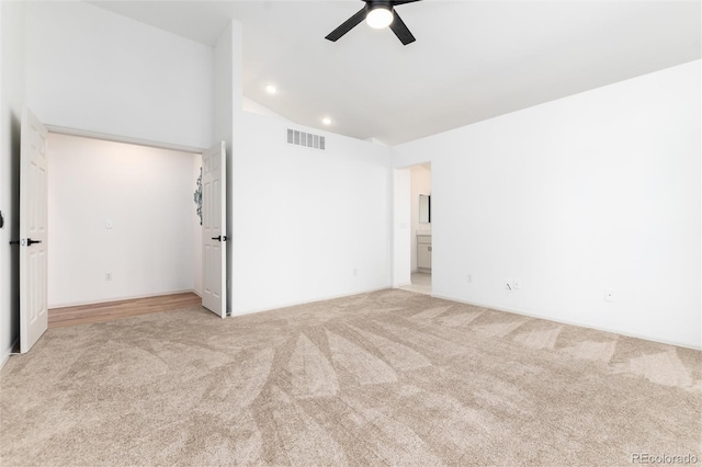 unfurnished bedroom with recessed lighting, visible vents, light colored carpet, and ensuite bathroom