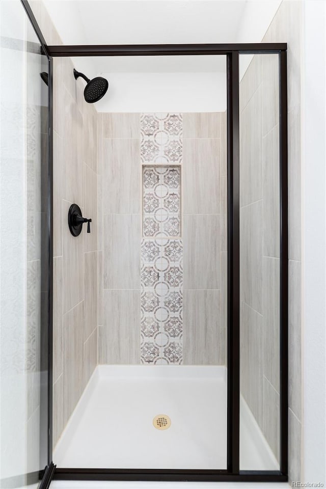 bathroom featuring a shower stall