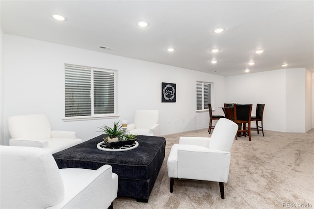 living room featuring recessed lighting, visible vents, and carpet floors