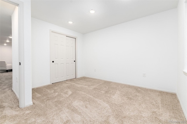 spare room with carpet flooring and recessed lighting