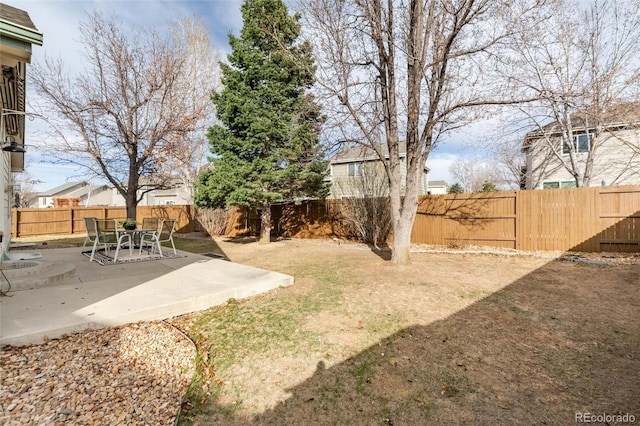 view of yard with a fenced backyard and a patio