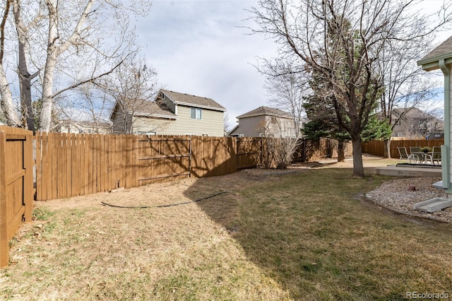 view of yard with a patio and a fenced backyard