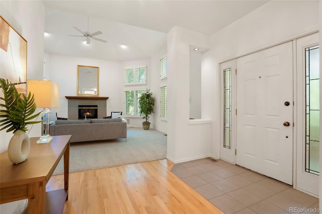 5530 Racquet Ln, Boulder, CO 80303 - entryway featuring ceiling fan, wood finished floors, and a glass covered fireplace