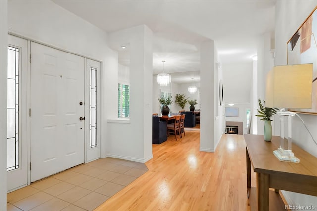 5530 Racquet Ln, Boulder, CO 80303 - entrance foyer featuring light wood finished floors and a chandelier