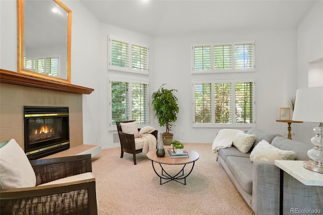5530 Racquet Ln, Boulder, CO 80303 - carpeted living room with a high ceiling and a tiled fireplace