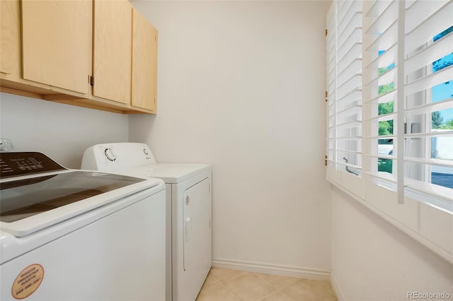 5530 Racquet Ln, Boulder, CO 80303 - laundry room with cabinet space, separate washer and dryer, and light tile patterned floors