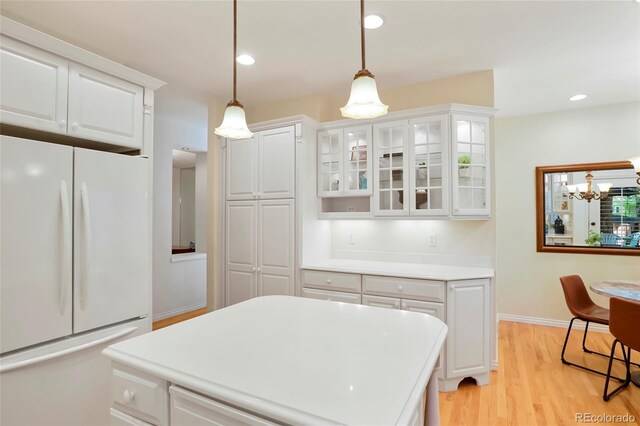5530 Racquet Ln, Boulder, CO 80303 - kitchen with freestanding refrigerator, light countertops, white cabinets, and recessed lighting