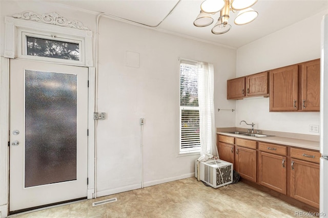 kitchen featuring a chandelier and sink