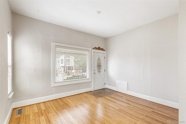 spare room with hardwood / wood-style flooring