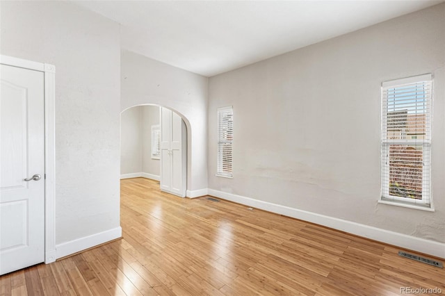 empty room with wood-type flooring