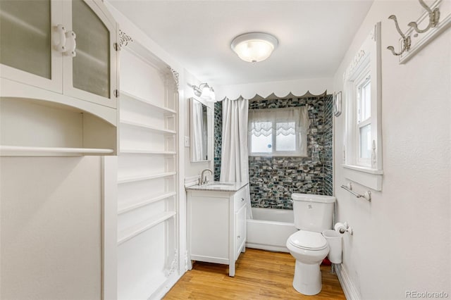 full bathroom with toilet, vanity, shower / tub combo, and hardwood / wood-style flooring