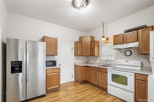 kitchen featuring sink, hanging light fixtures, light hardwood / wood-style flooring, stainless steel refrigerator with ice dispenser, and white range with electric stovetop